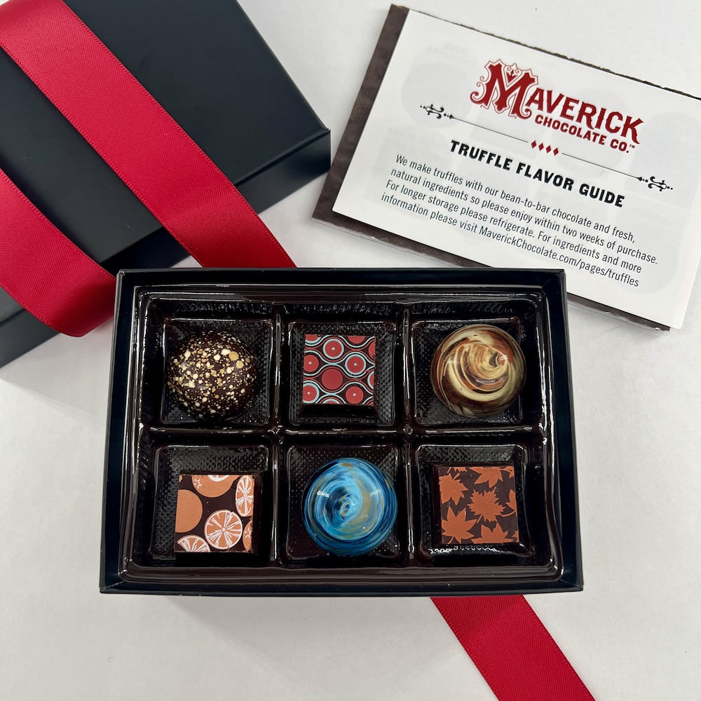 Box of truffles with a 'Maverick Chocolate Co.' flavor guide on a white background